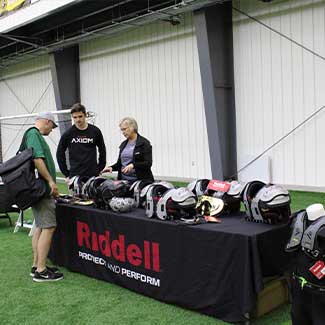 Football gear set up at a tradeshow boot at the AHN Montour Sports Complex in Coraopalis PA.